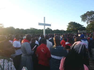 Pilgrims carrying a cross