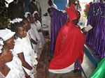 Bishop André praying with the confirmation candidates